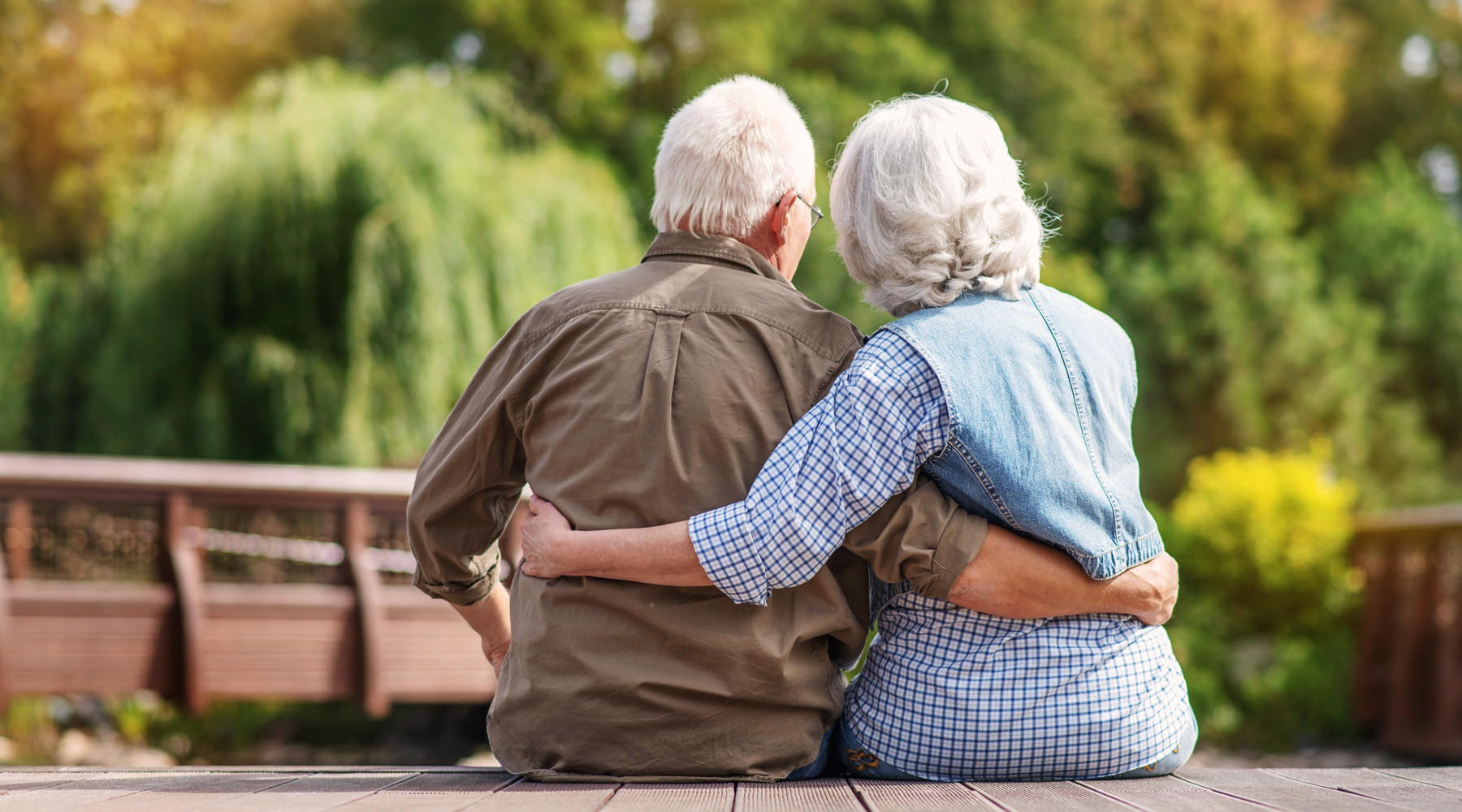 Couple relaxing on a pier