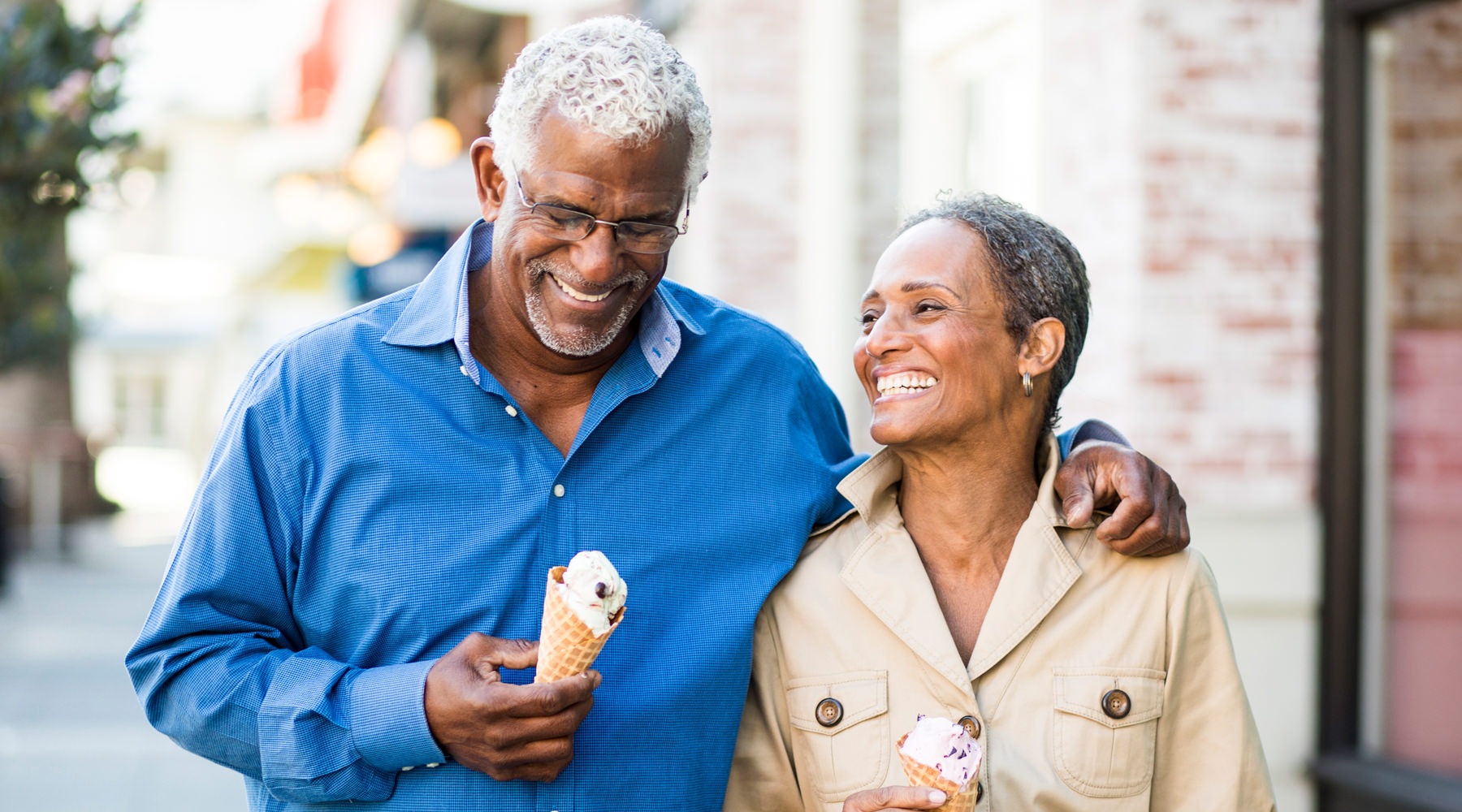 Couple having fun in the city with ice cream